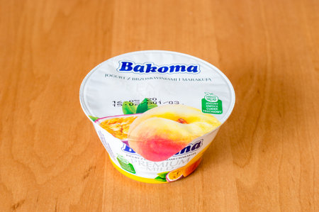 Deblin, Poland - April 21, 2020: Bakoma yogurt with peaches and passion fruit.のeditorial素材