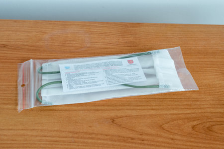 Pruszcz Gdanski, Poland - April 15, 2020: Coronavirus protection mask. Mask issued by the city hall in Pruszcz GdaÅski.のeditorial素材