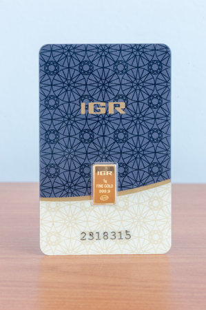 Pruszcz Gdanski, Poland - May 6, 2020: 1 gram of weight fineness gold certified assayer. IGR Istanbul Gold Refinery 1 gram of Fine Gold 999,9. Gold bar weighing 1 gram.のeditorial素材