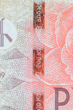 Plastic security strip on 500 CZK banknote. Security strip on Czech koruna banknote created to prevent counterfeiters.の写真素材