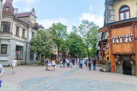 Zakopane, Poland - June 14, 2020: Unidentified tourists crowded on famous Krupowki street.のeditorial素材