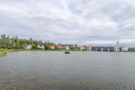 Panoramic view of Tjornin at cloudy day.の写真素材