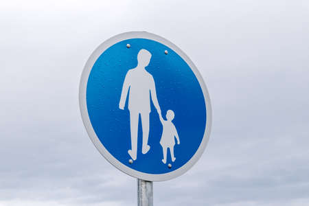 Traffic sign pedestrian after rain.の写真素材