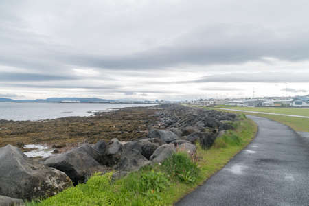 Sculpture and Shore Walk at cloudy day at Seltjarnarnes, Iceland.の写真素材