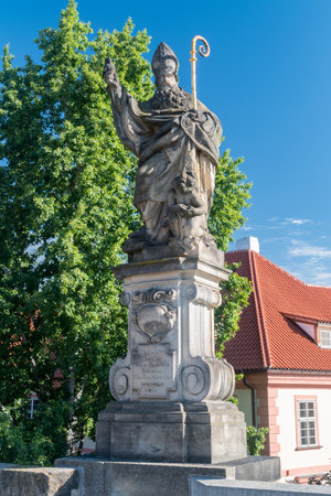 Prague, Czech Republic - July 10, 2020: Statue of Augustine of Hippo installed on the north side of the Charles Bridge.のeditorial素材