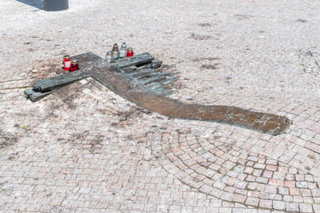 Prague, Czech Republic - July 10, 2020: Bronze cross on pavement, memorial to Jan Palach and Jan Zajic in front of the National Museum.のeditorial素材