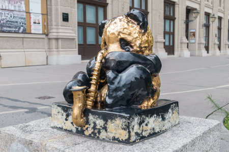 Vienna, Austria - August 30, 2020: Sculpture of a panda playing a saxophone.のeditorial素材
