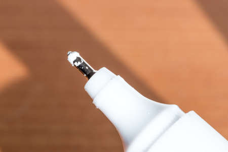 Dirty end of correction pen. Detail of used correction pen.