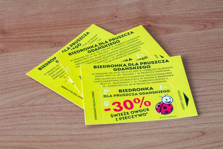 Pruszcz Gdanski, Poland - January 17, 2021: Discount cards to Biedronka for fresh fruits and baked goods.のeditorial素材