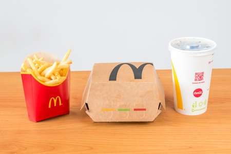 Pruszcz Gdanski, Poland - January 17, 2021: McDonald's french fries, sandwich paper box and coke.