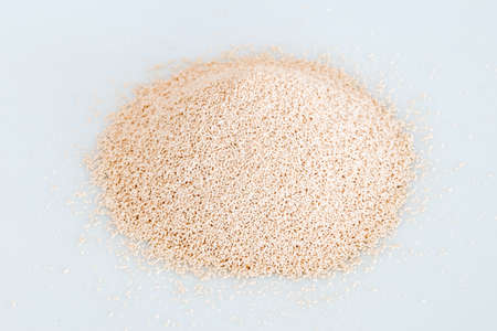 Active dry yeast on white background.の写真素材