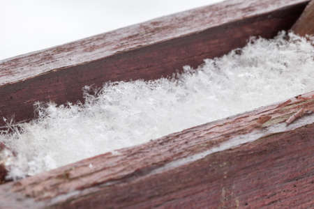 Detail of natural snowflakes on wooden. Macro photo of snow.の写真素材