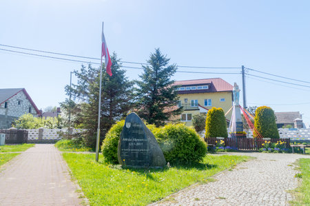 Skowarcz, Poland - May 12, 2021: Square with stone monument for 800th anniversary of Skowarcz.のeditorial素材
