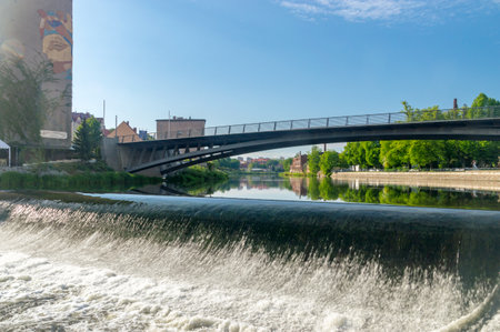 Gorlitz, Germany - June 2, 2021: Waterfall on Lusatian Neisse river.