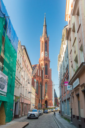 Walbrzych, Poland - June 3, 2021: Street view with tower of Holy Guardian Angels church in Walbrzych.のeditorial素材