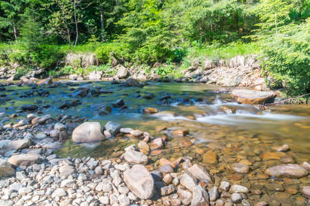 Summer view on rocky creek Czarna Wiselka with long exposure.の写真素材