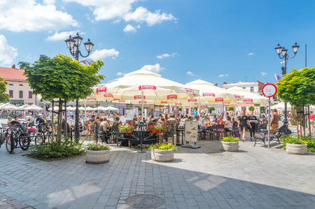 Zywiec, Poland - June 6, 2021: Main market square with drinking outside square.のeditorial素材