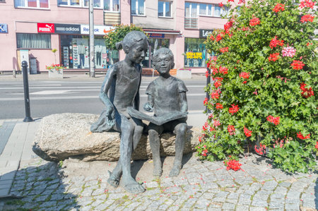Garwolin, Poland - June 15, 2021: Sculpture of children with a book and history learners.のeditorial素材
