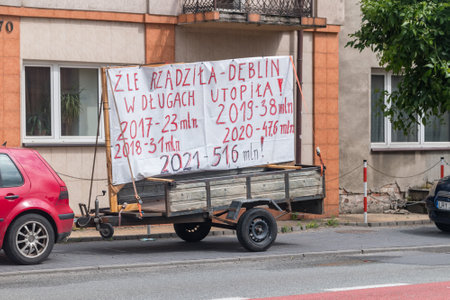 Deblin, Poland - June 13, 2021: Poster informing about the debt of the city of Deblin.のeditorial素材