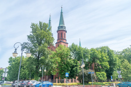 Pruszkow, Poland - June 15, 2021: Summer view with towers of Church of Saint Casimir.のeditorial素材