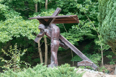 Gdansk, Poland - July 7, 2021: Simon of Cyrene helps Jesus carry the Cross, Stations of the Cross at Sanctuary of Our Lady of Pregnancy in Gdansk Matemblewo.のeditorial素材