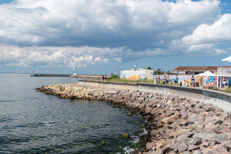 Hel, Poland - July 20, 2021: Rocky coastline on Hel Peninsula near harbor.のeditorial素材