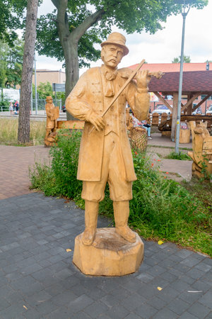 Hel, Poland - July 20, 2021: Wooden sculpture of man on Kashubian Sculpture Gallery in Hel.のeditorial素材