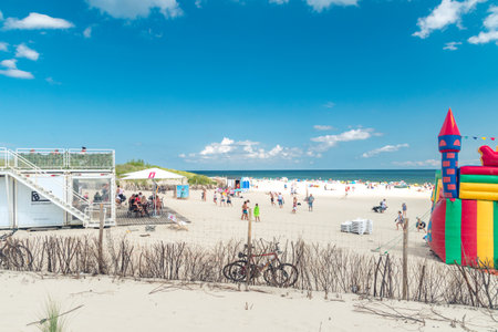 Hel, Poland - July 20, 2021: People rest on the beach on Hel Peninsula of the Baltic Sea at summer time.のeditorial素材