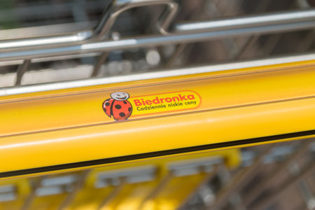 Starogard Gdanski, Poland - July 25, 2021: Logo of Biedronka on shopping cart. Biedronka is one of the largest chain supermarkets in Poland.のeditorial素材