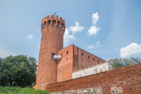 Swiecie, Poland - July 25, 2021: Circular tower topped with merlons, part of a complex built by the Teutonic Knights in the Gothic architectural style.のeditorial素材