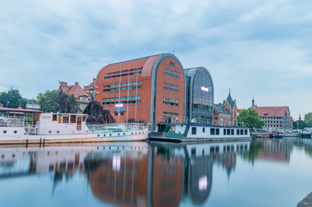 Bydgoszcz, Poland - July 25, 2021: mBank office building on Brda river. Buildings known as New granaries or glass granaries.のeditorial素材