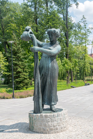 Starogard Gdanski, Poland - July 25, 2021: Monument to the Miss Wierzyczanka with a jug, a sculpture by Adam Smolan.のeditorial素材