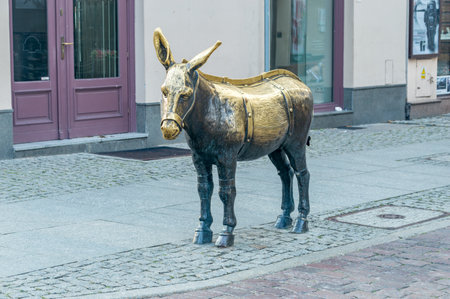 Torun, Poland - July 26, 2021: Sculpture of a donkey in old town of Torun.のeditorial素材