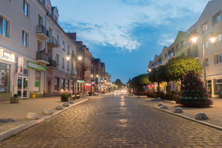 Malbork, Poland - July 26, 2021: Cobbled Tadeusz Kosciuszko street at dusk.のeditorial素材