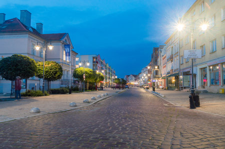 Malbork, Poland - July 26, 2021: Cobbled Tadeusz Kosciuszko street in the evening.のeditorial素材