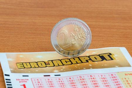 Pruszcz Gdanski, Poland - July 29, 2021: 2 euro coin on Euro JackPot on lottery ticket.のeditorial素材