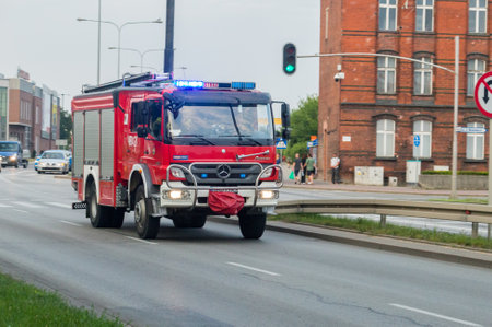Malbork, Poland - July 26, 2021: Polish firefighters in the fire brigade vehicle.