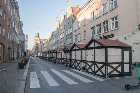Gdansk, Poland - july 31, 2021: Alley with closed stalls of St. Dominic Fair in the morning.