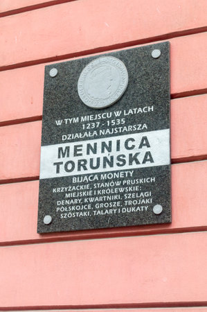 Torun, Poland - July 26, 2021: Information board in the place where the Torun mint operates.のeditorial素材
