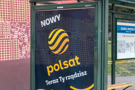 Gdansk, Poland - July 31, 2021: New Polsat logo on bus stop.のeditorial素材