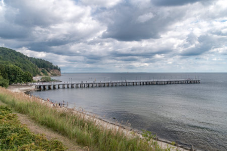 Wooden pier on Baltic Sea in Gdynia Orlowo at cloudy summer day.の写真素材