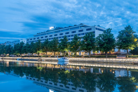 Turku, Finland - August 5, 2021: Turku early morning view on embankment of Aura river with Radisson blu hotel in background.のeditorial素材