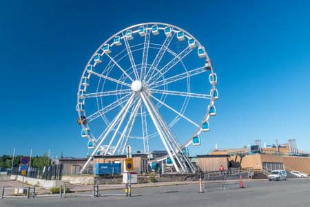 Helsinki, Finland - August 5, 2021: Ferris wheel called Helsinki SkyWheel at harbor in Helsinki.のeditorial素材