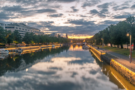 Turku, Finland - August 5, 2021: Sunrise view on Aurajoki river with Turku Cathedral in the background in Turku, Finland.のeditorial素材