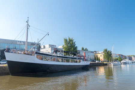 Turku, Finland - August 6, 2021: Wanha Rahtilaiva restaurant ship on Aurajoki river.のeditorial素材