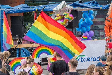 Gdansk, Poland - August 21, 2021: LGBT Pride flag among crowd of people on march of LGBTQ pride parade.のeditorial素材