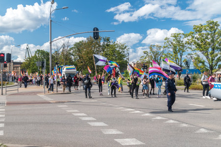 Gdansk, Poland - August 21, 2021: LGBT pride parade. Crowds walk and hold various flags.のeditorial素材