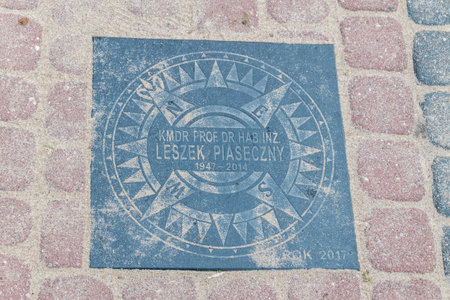Rewa, Poland - August 21, 2021: National Alley of Merit of the Sea People named after Marshal Jozef Pilsudski. Plaque of Leszek Piaseczny.のeditorial素材