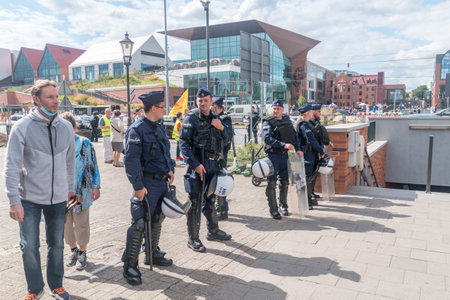 Gdansk, Poland - August 21, 2021: Police in riot gear holding the line to protect counter-manifestation of LGBT.のeditorial素材