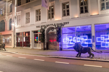 Oslo, Norway - September 24, 2021: The mini bottle gallery at night. Gallery with miniature bottles.のeditorial素材